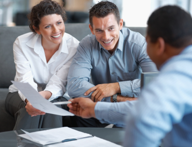 Financial planner helping a couple with their banking accounts